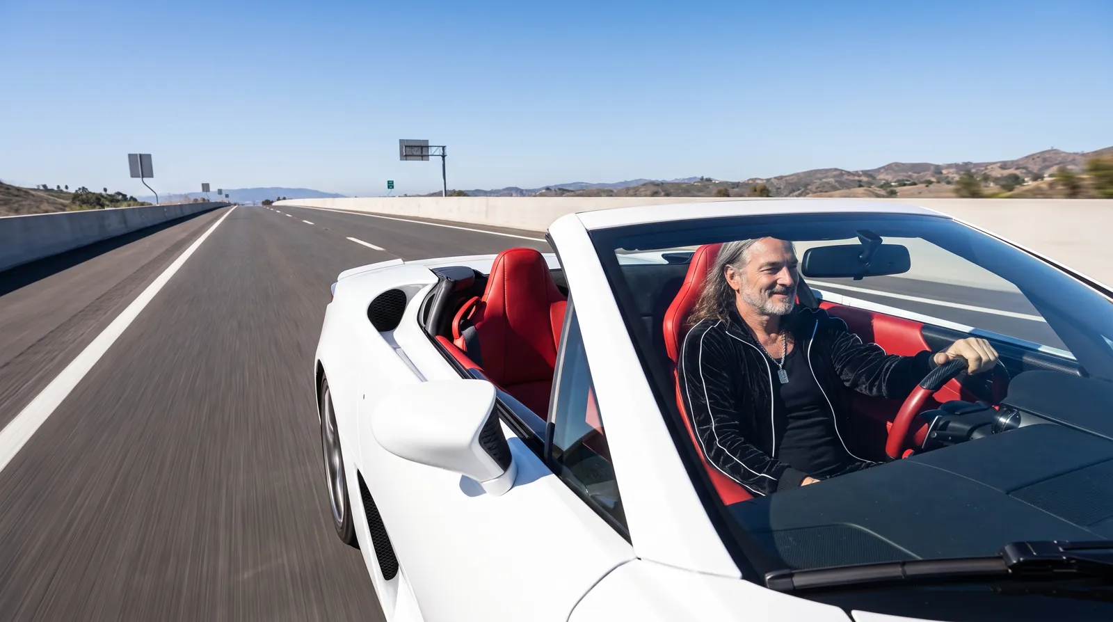 Cloud9 driving a white convertible down an open highway